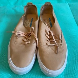 Peach colored leather low profile vans